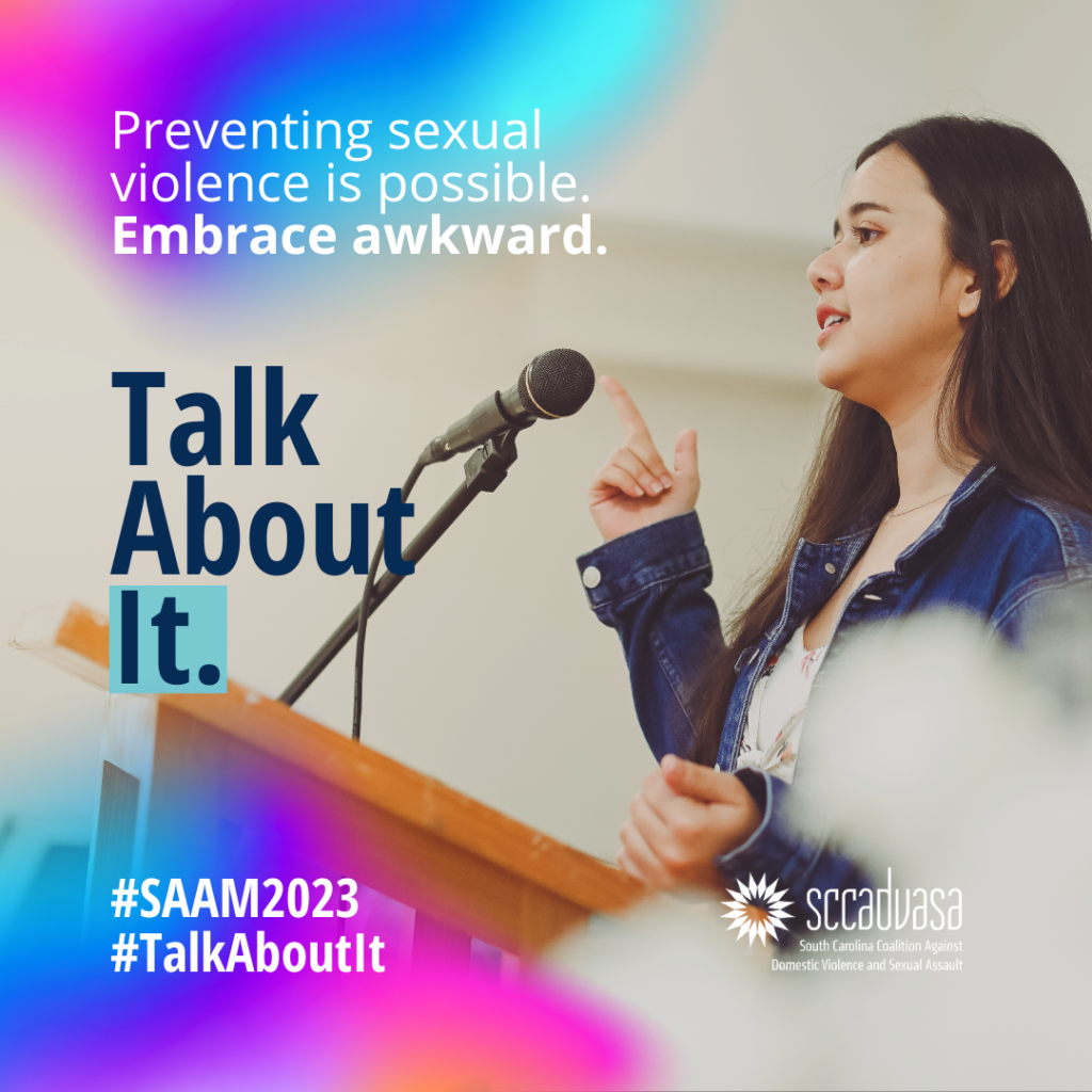 A college student stands at a podium with a microphone and speaks using hand gestures with text that says ‘Preventing sexual violence is possible. Embrace awkward. Talk About It. #SAAM2023 #TalkAboutIt’ includes SCCADVASA logo