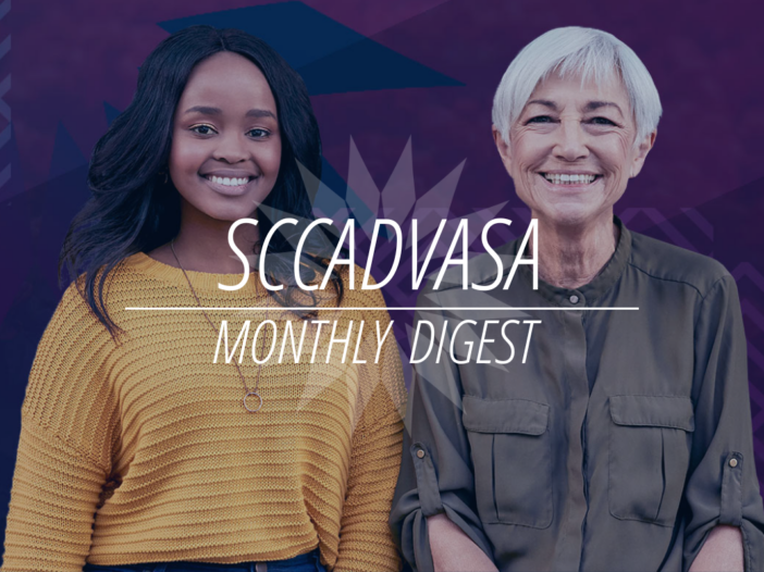 A young black woman and an older Caucasian female stand next to one another and smile with text that says 'SCCADVASA Monthly Digest'